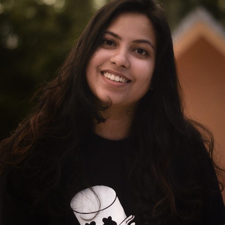 Alex Rivera, Lead Design Curator at Vivid Thread Seek, reviewing corporate floral arrangements